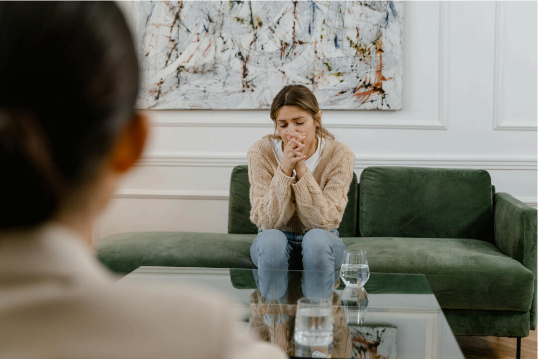 girl sitting on a therapy coach